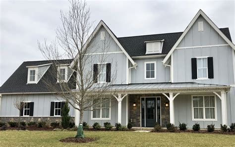 gray metal roof gray house|black roof with gray siding.